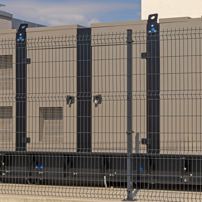 Enclosed generator set on a hard standing