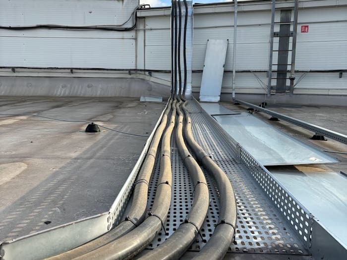 Cables laid in a cable tray on the roof of the building