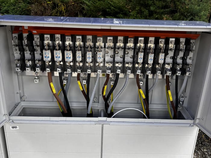 Fuse strips in the cabinet with the cables connected and the ways labelled